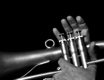 A jazz musician plays the trumpet.