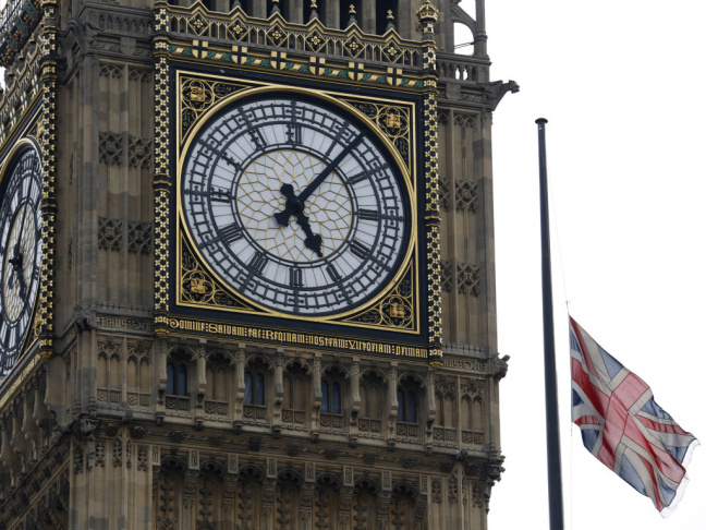 A Union flag flies at half staff over the Houses of Parliament, and next to the Big Ben clock tower, in honor of former Prime Minister Margaret Thatcher, who died Monday.