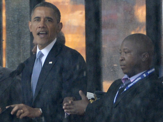 As President Obama and other world leaders spoke Monday in Johannesburg at a memorial for Nelson Mandela, a man stood nearby and appeared to be doing sign language interpretation. Many in the deaf community are outraged because the man appeared to be faki