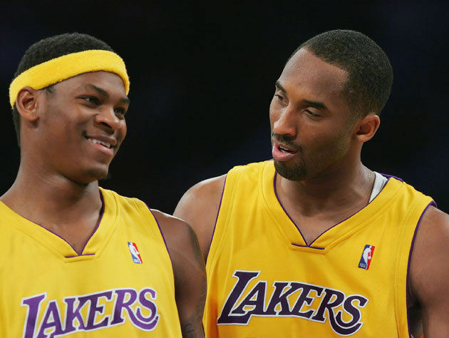 Kobe Bryant #24 talks with his teammate Smush Parker #1 of the Los Angeles Lakers during the game against the New York Knicks on February 13, 2007 at Staples Center in Los Angeles, California.