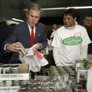 US President George W. Bush grabs a can of peaches