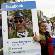 A reveller fancy dressed as a Facebook p