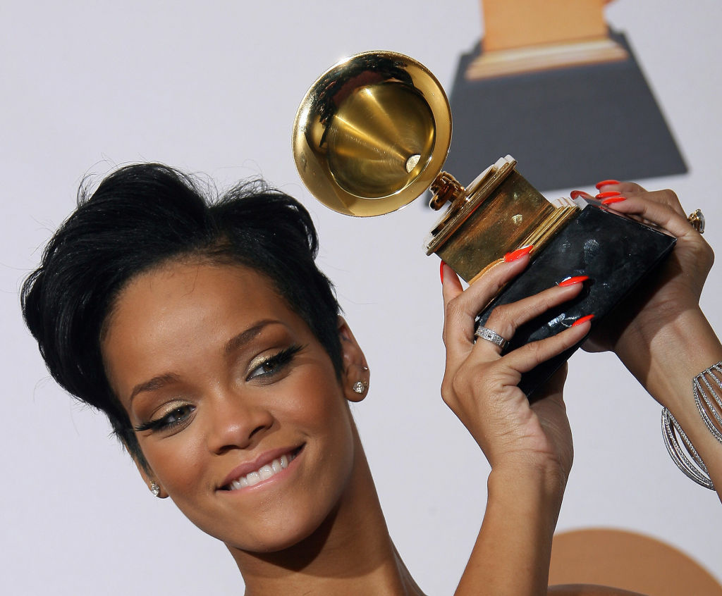 Rihanna poses with the trophy at the 50th Grammy Awards. LAPD officers accused of leaking photos of pop singer Rihanna after her 2009 beating at the hands of Chris Brown will not be charged.
