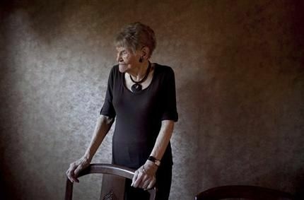 In this Dec. 28, 2011 photo, 100-year-old Minka Disbrow stands in her apartment in San Clemente, Calif. Disbrow, who was raped at age 16, has lived to be 100 - long enough to meet the daughter she gave up at birth 77 years earlier and learn about the six grandchildren she didn't know she had.