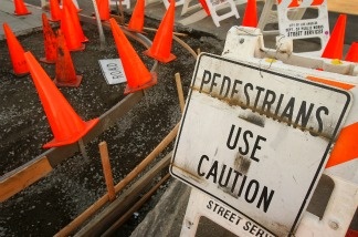 Cones cover the site of a public sidewalk repair project on February 10, 2009 in Los Angeles, California.