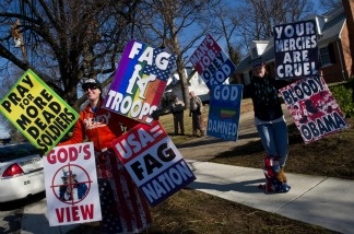 Members of the Westboro Baptist Church, a Kansas known for its vehement anti-gay positions and for protesting at US soldiers' funeral, stage a protest across the street from Northwestern High School in Hyattsville, Maryland, outside Washington, on March 1, 2011.