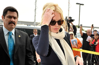 Lindsay Lohan arrives for a preliminary hearing to determine if she will stand trial for felony grand theft at the Airport Courthouse April 22, 2011 in Los Angeles, California.