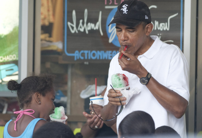 US President Barack Obama eats a shave i