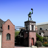 Kermit the Frog sit atop the entry gates to the Jim Henson Company studios.