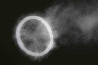 A smoke ring in the form of the number zero.