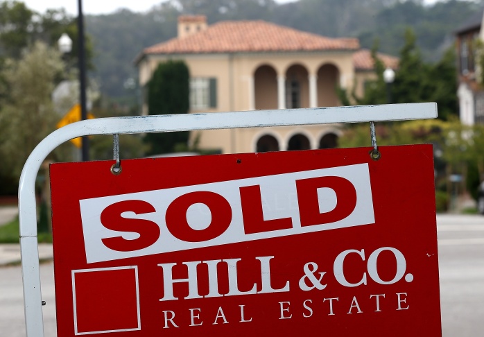 A sold sign is posted in front of a home for sale on July 30, 2013 in San Francisco, California.