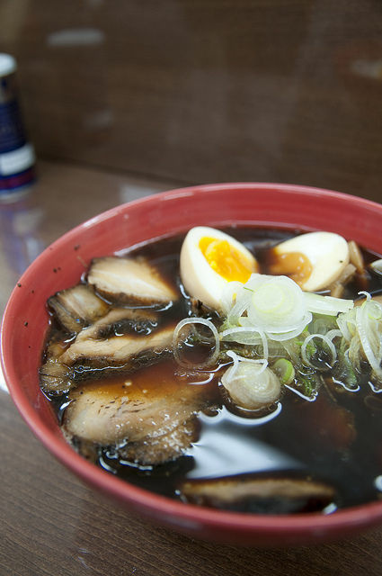 A bowl of black soy sauce ramen