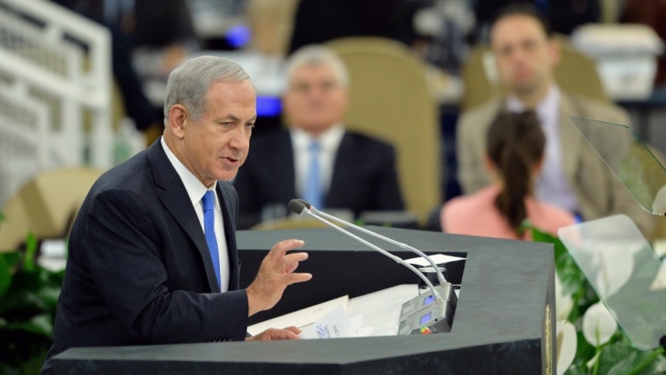 Israel's Prime Minister Benjamin Netanyahu told officials at the U.N. General Assembly Tuesday that it's too early to ease sanctions on Iran, urging them not to be fooled by what he called a charm offensive by President Hasan Rouhani.
