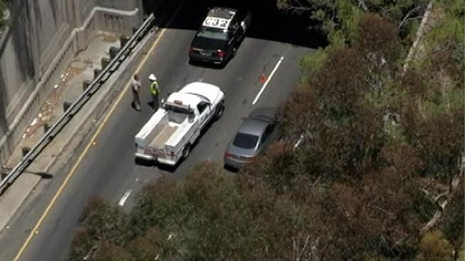 Two northbound lanes of the 110 Freeway north of downtown Los Angeles were shut down Wednesday after water started leaking from a busted pipe in the ceiling of a historic tunnel.