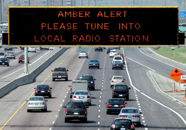 File: An Amber Alert road sign.