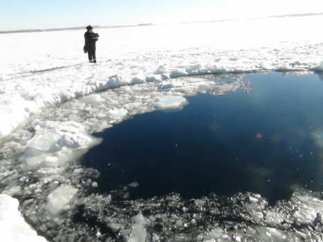 A circular hole in the ice of Chebarkul Lake, where the Chelyabinsk meteor reportedly struck on Feb. 15.