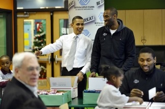 President Barack Obama chats with Los Angeles Laker Kobe Bryant as they pack gifts for troops at a Boys and Girls Club in Washington, D.C., on Dec. 13, 2010. Obama welcomed the Lakers to honor their 2009-2010 season and their second consecutive NBA championship.