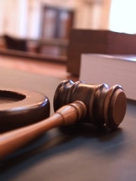 A judge's gavel in a courtroom.