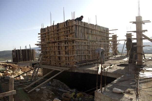 Workers construct new houses in the Jewish settlement of Shilo in the West Bank, back in February.