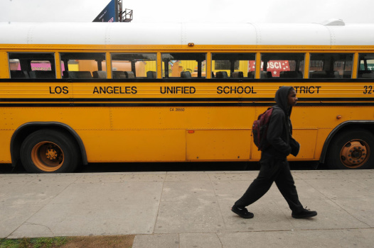 A student on his way to school walks pas