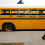 A student on his way to school walks pas