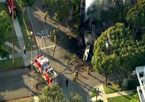 A small plane crashed into a tree in a Westwood neighborhood on Friday, August 10, 2012.