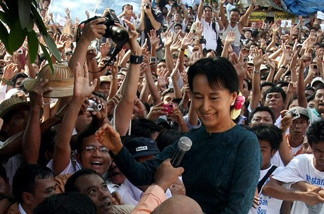 Newly released opposition leader Aung San Suu Kyi arrives at the National League for Democracy headquarters in Yangon Friday.