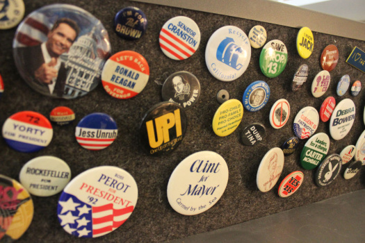 Close up of Patt Morrison's political button collection