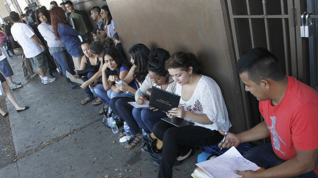 A crowd seeks help applying for the Deferred Action for Childhood Arrivals program at the Coalition for Humane Immigrant Rights of Los Angeles in August. Schools have been inundated with requests for the documents needed to qualify.