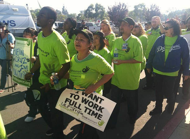 Walmart workers from across SoCal march in front of the Walmart in Paramount, CA.
