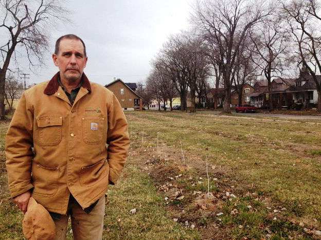 Mike Score, president of Hantz Farms, shows off a small-scare version of what Hantz Woodlands will look like