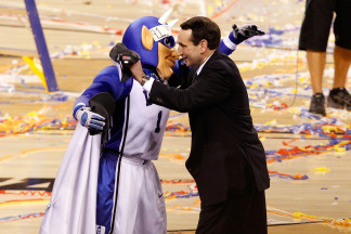 Head coach Mike Krzyzewski and the Duke Blue Devils mascot celebrate after their 61-59 win against the Butler Bulldogs during the 2010 NCAA Division I Men's Basketball National Championship game at Lucas Oil Stadium on April 5, 2010 in Indianapolis, Indiana.