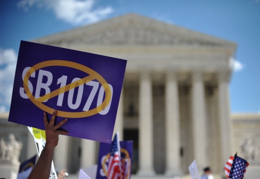 A protester holds a placard during a pro