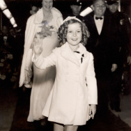 Child film star Shirley Temple (1928- ) arrives at