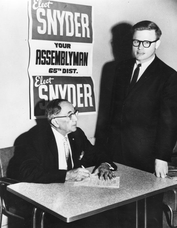Art Snyder (right) with voter, 1967.