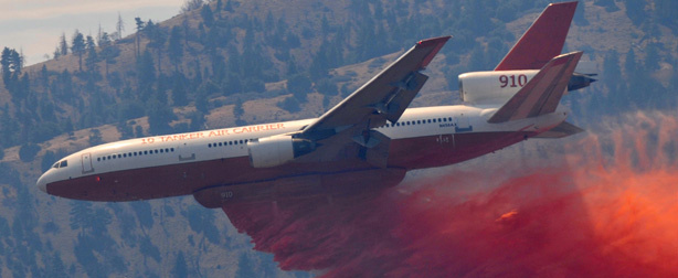 In this Sept. 5. 2011 file photo, a DC-10 airplane drops retardant to help put out the wildfire in Tehachapi, Calif. on.
