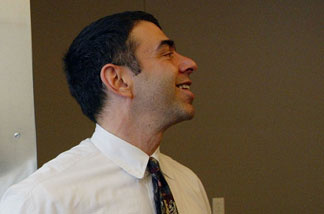 Dr. Mitchell Katz, San Francisco Director of Health, stands near a welcome sign during the opening of Magnet, a new sexual health clinic for gay men July 1, 2003 in San Francisco, California.