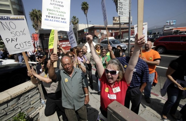 Grocery store workers lead a rally on June 14, 2011 to demand a "fair and timely" contract from the major stores.