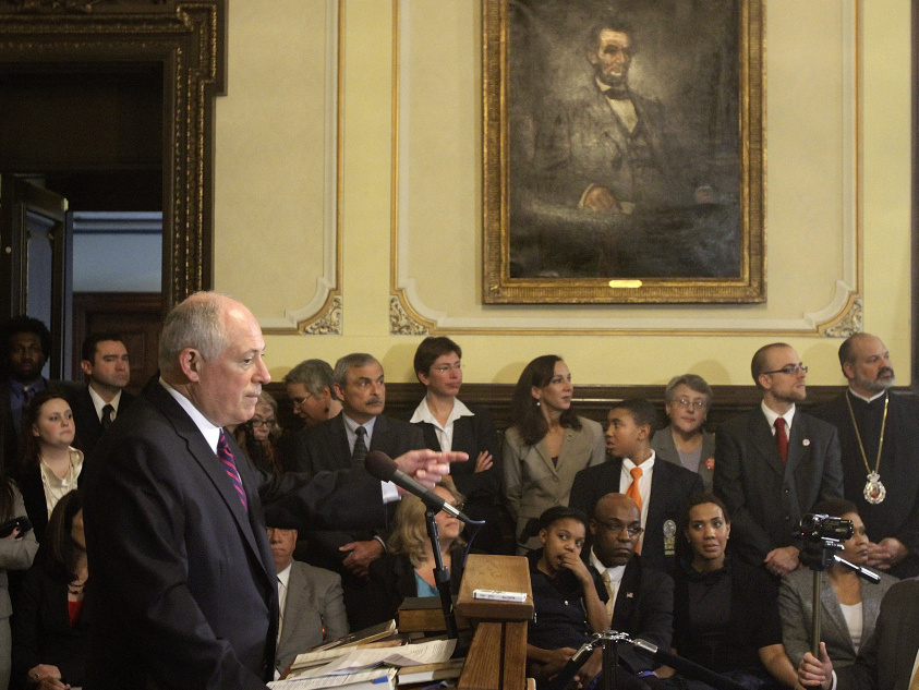 Illinois Gov. Pat Quinn speaks with reporters at the Capitol in 2011 after signing legislation abolishing the death penalty in the state.