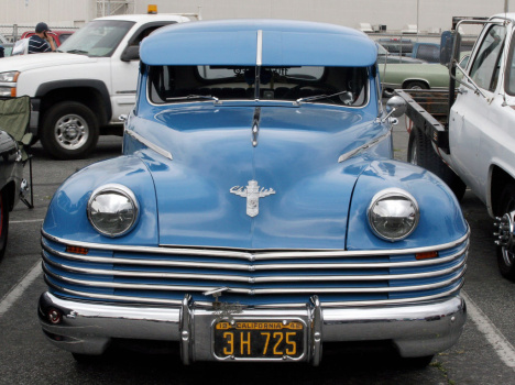 A blue Chrysler is on display at Long Be