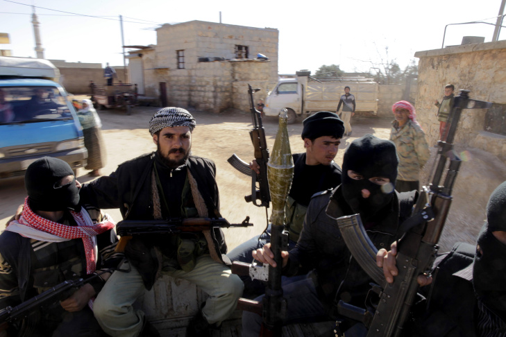 Syrian rebels patrol in the north of nor