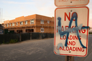 Graffiti is seen on a sign near a new townhouse construction site March 3, 2009 in Compton, California.