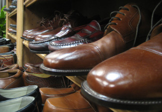 Men's shoes line the wall of the men's section at Working Wardrobes in Costa Mesa. The non-profit organization helps dress people who are down on their luck and trying to re-enter the workforce.