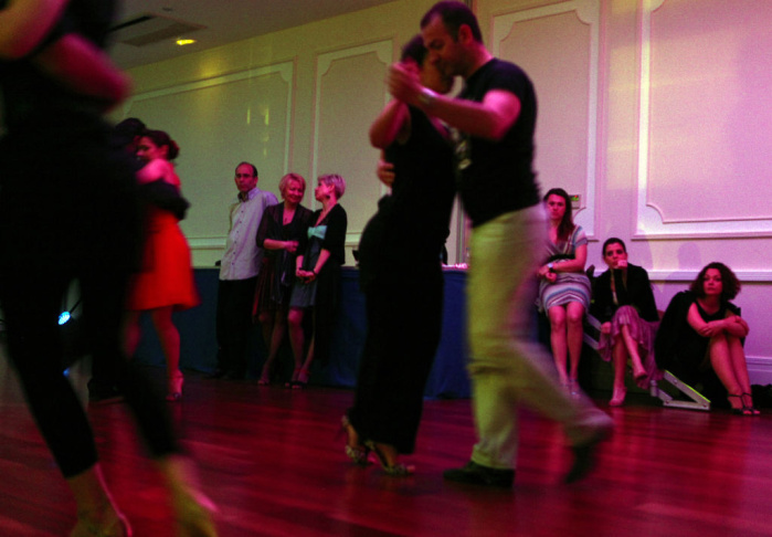 Cypriot couples perform a tango dance in