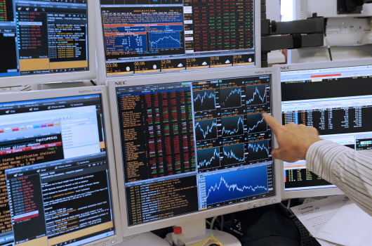 A trader shows a graph illustrating stoc