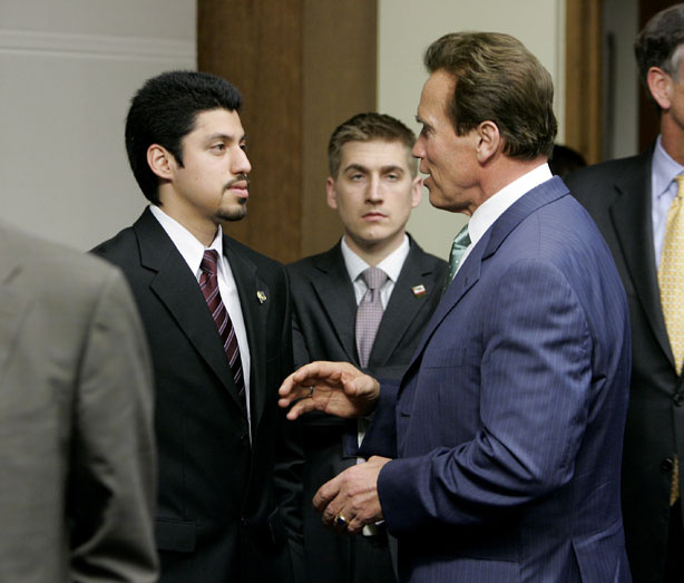 Gov. Arnold Schwarzenegger, right, talks with Victor Sanchez, President of the University of California Student Association after a higher education meeting held at the Capitol Sacramento, Calif., Wednesday, March 3, 2010. Schwarzenegger met with leaders of California's colleges and universities to discuss budget cuts that have left higher education in critical condition.