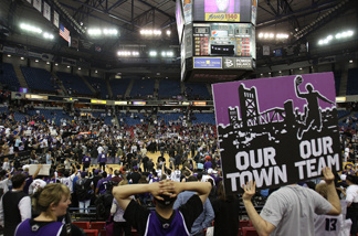 Fans of the Sacramento Kings hold up signs against the Los Angeles Lakers on April 13, 2011 at Power Balance Pavilion in Sacramento, California.