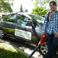 Michael Gould of Whisper Landscape Maintenance poses with his leaf blower.