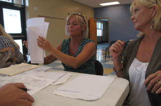 Twin sisters Sheila Newman (left) and Sheryl Lindsay of Orange Beach, Ala., make their case to a BP claims adjuster. The wedding planners have been trying since June to get BP to pay for lost income from the oil spill.