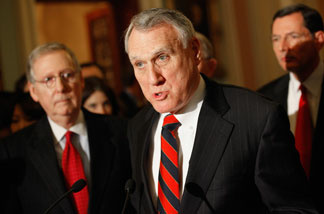 Senate Minority Whip Jon Kyl (R-AZ) (C) makes brief remarks to the press with Senate Minority Leader Mitch McConnell (R-KY) (L) and Sen. John Barrasso (R-WY) after the weekly Senate Republican Policy Luncheon in the U.S. Capitol January 25, 2011 in Washington, DC.